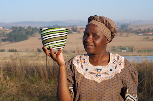 Zulu woman showing a bowl